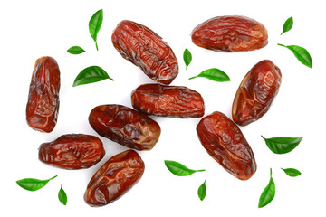 dry dates decorated with leaves isolated on white background. Top view. Flat lay pattern