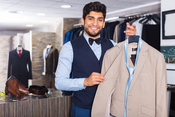 Man demonstrating suit in shop