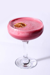 Pink cocktail on white background