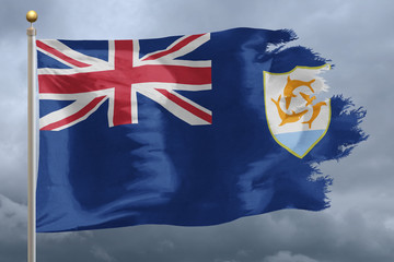 Anguilla Flag with torn edges in front of a stormy sky