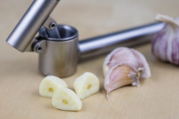 A healthy and medicinal garlic syrup squeezed with a kitchen squeezer. Natural methods of treating colds.