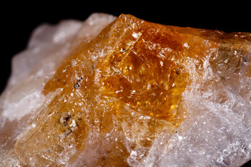 Macro mineral stone Citrine on black background