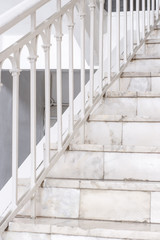 Beautiful Marble staircase with white railing leading upwards