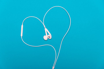White headphones in the form of a heart