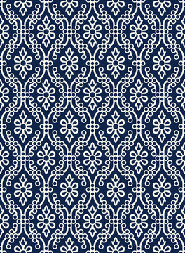 Indigo dye woodblock printed seamless ethnic floral damask pattern. Traditional oriental ornament of India Kashmir,  geometric flowers and ogee molding, ecru on navy blue background. Textile design.