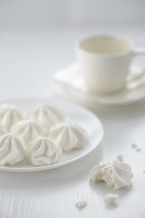 meringues in a plate on a white background