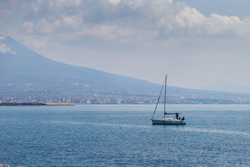 Fototapeta premium yacht stand still in the water of the gulf of Naples, Italy.