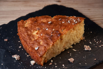 Delicious fresh baked piece of apple pie on shale board
