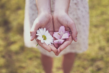 Girl shows the blooms in her hand