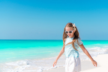 Fototapeta na wymiar Adorable little girl on tropical beach
