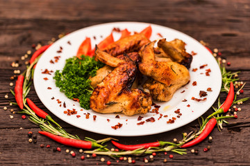 Chicken wings grilled with spices and chili pepper