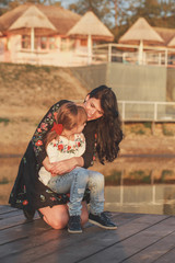 Mother hugging her daughter