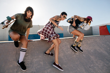 Female skaters having fun at skate park © Jacob Lund