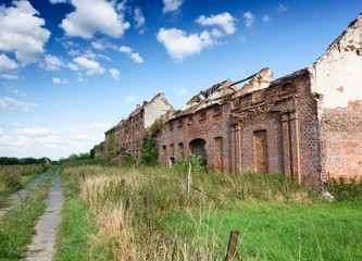 Ruined building and grass field