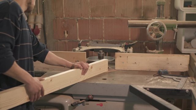 Carpenter cutting wood
