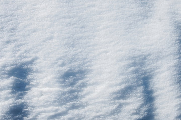 relief of white snow in the mountains in the sun textural background