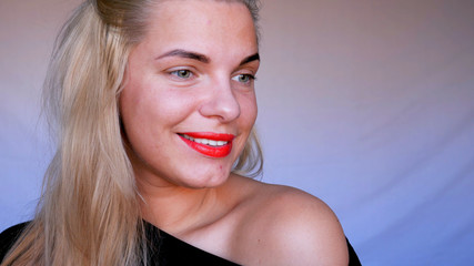 Naklejka premium Young beautiful woman, red lips, powdered cheeks, white blue background.