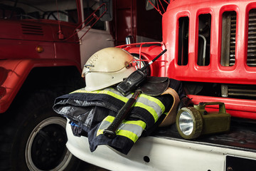 Firemen gear on firetruck such as fire barrel, special clothing, ration, helmet and lamp