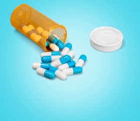 Bottle pills on blue background
