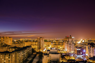 Aerial view at evening cityscape, Voronezh city downtown panorama, high-rise residential houses,  business buildings, urban after dawn