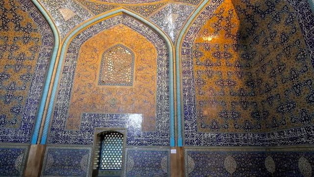 ISFAHAN, IRAN - OCTOBER 21, 2017: The picturesque tiled patterns in prayer hall of Sheikh Lotfollah mosque - the outstanding architectural landmark of Naqsh-e Jahan Square, on October 21 in Isfahan.