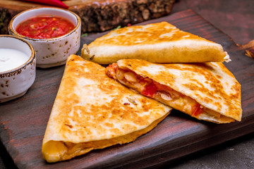 Quesadilla with chicken and sauces