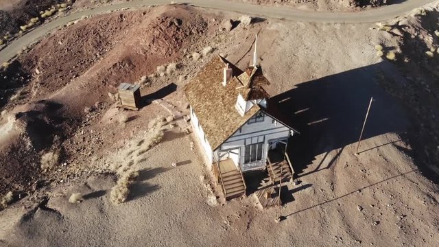 Old vintage house in village of golden miners in desert