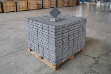 Concrete road curbs at the factory for the production of cement products, paving slabs