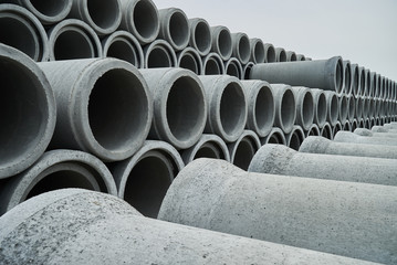 Stacked pipe at concrete factory. Large Concrete Construction Pipes for Underground Water