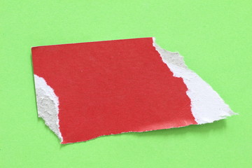 colored torn paper as a background. copy space