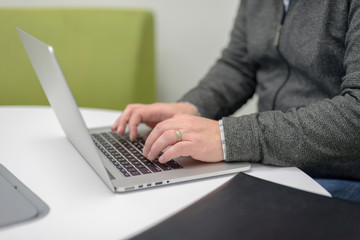 Man typing on laptop