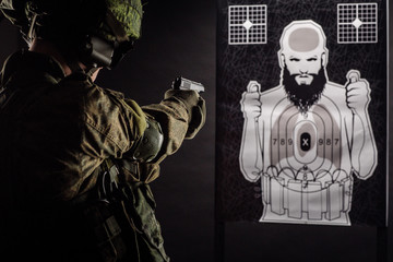 russian special forces soldier with rifle on dark background. army, military and people concept
