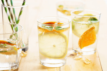 citrus fruit water with mint leaves