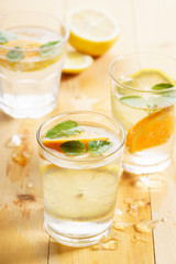 citrus fruit water with mint leaves