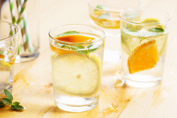 citrus fruit water with mint leaves