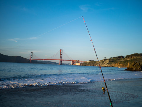 Fishing rod posted up with Golden Gate Bridge in background