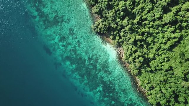 Aerial view from a drone of beautiful Nyaung Oo Phee island on sunny day in Myanmar
