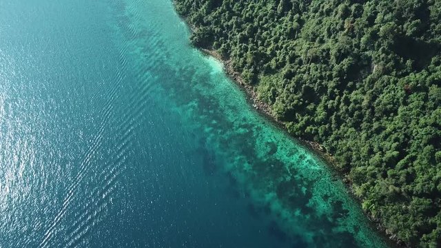 Aerial view from a drone of beautiful Nyaung Oo Phee island on sunny day in Myanmar
