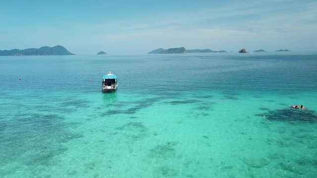 Aerial view from a drone of beautiful Nyaung Oo Phee island on sunny day in Myanmar
