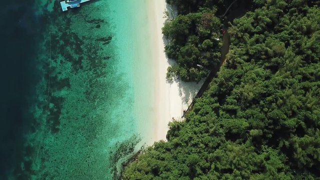 Aerial view from a drone of beautiful Nyaung Oo Phee island on sunny day in Myanmar
