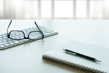 Close up of glasses and computer  business workplace work place in office