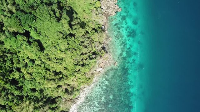 Aerial view from a drone of beautiful Nyaung Oo Phee island on sunny day in Myanmar
