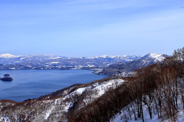 Fototapeta na wymiar Landscape overlooking the winter of lake toya from summit