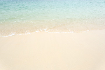 Fototapeta na wymiar Beautiful ocean wave on white sandy beach