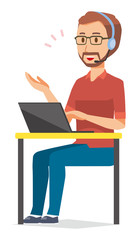 A bearded man wearing eyeglasses is talking on income