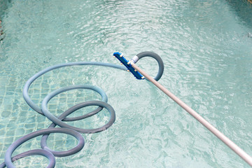 Cleaning swimming pool with vacuum tube