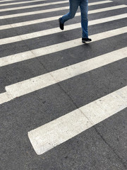 Zebra crossing with a person walking