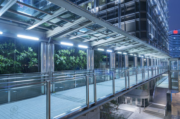 Modern pedestrian walkway at night