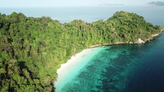 Aerial view from a drone of beautiful Nyaung Oo Phee island on sunny day in Myanmar
