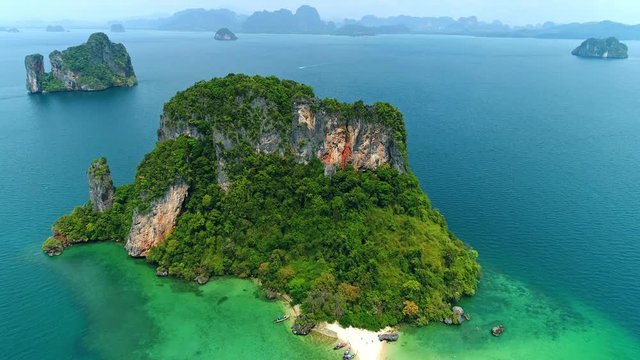 Aerial view of beautiful white sand beach and crystal Andaman sea against blue sky at Thailand